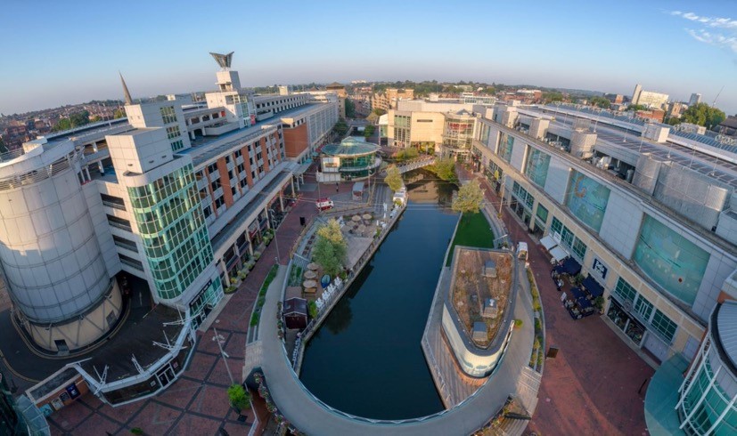 the Kennet & Avon Canal in central Reading, flanked by The Oracle retail and leisure complex. The canal enabled the growth of modern Reading from the 18th century - after its closure in 1955 it was reopened to boat traffic in 1990 (credit: James Singleton www.jsaerial.co.uk.)