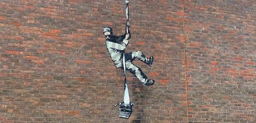 ‘Banksy’ artwork, Create Escape, on the wall of Reading Gaol