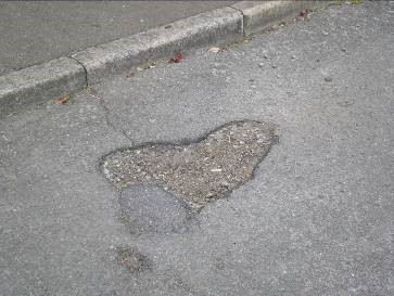 Defect in road surfacing