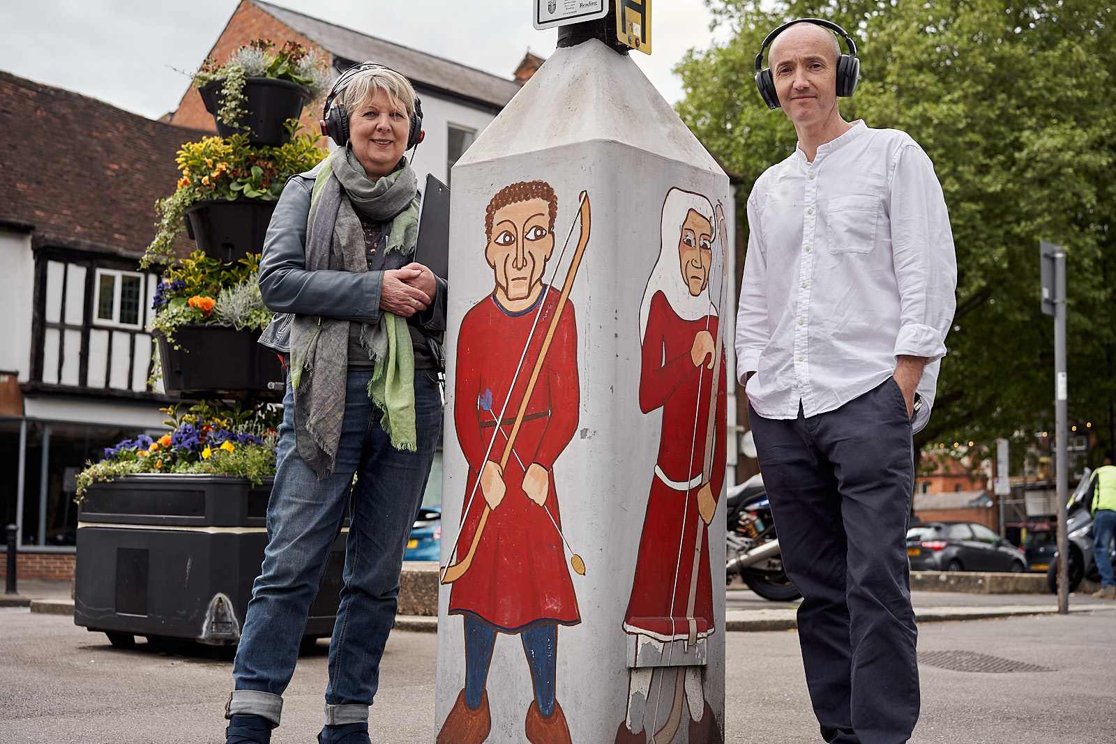 Fional Talkington and Richard Bentley stand beside decorated lamp post on St Mary's Butts