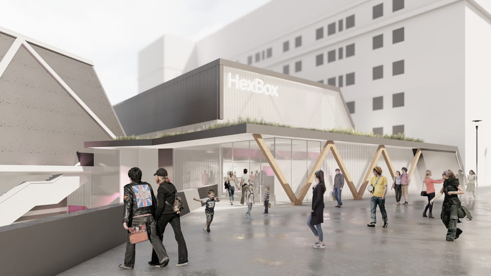 Design shows people milling about outside an extension of the Hexagon called the HexBox.