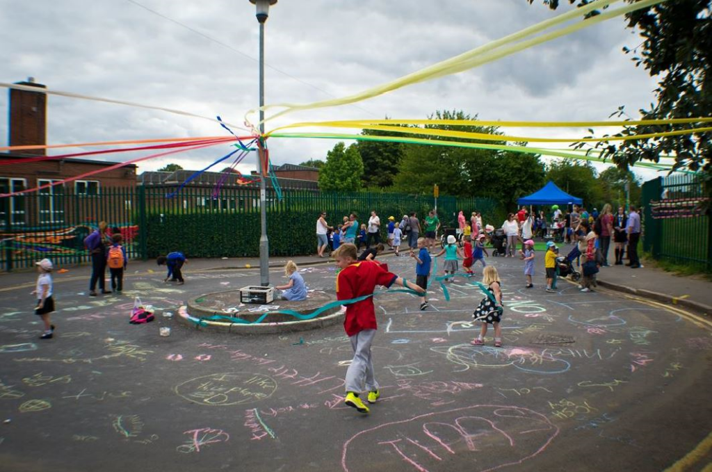 Children playing on a car-free road.