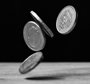 Coins falling onto a table.