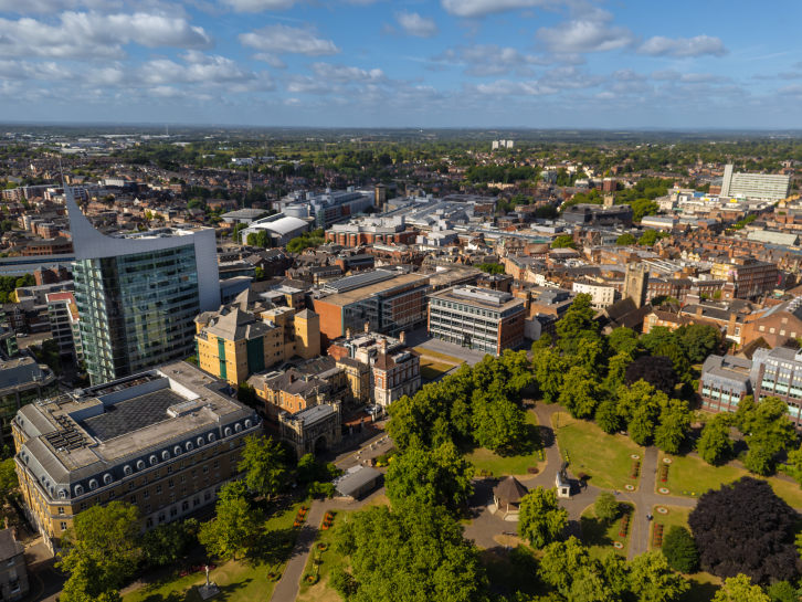 Reading Town Centre drone photo includes building rooftops and Forbury Gardens from above