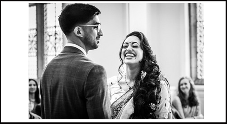 Bride and groom standing in the Ceremony Room, making vows.