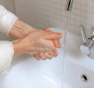 Somene washing their hands.