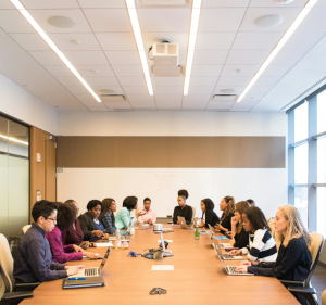 People sat around a board table.