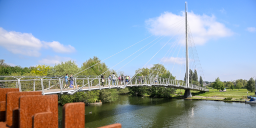 View from south side of Thames looking across the river showing the pedestrian bridge.