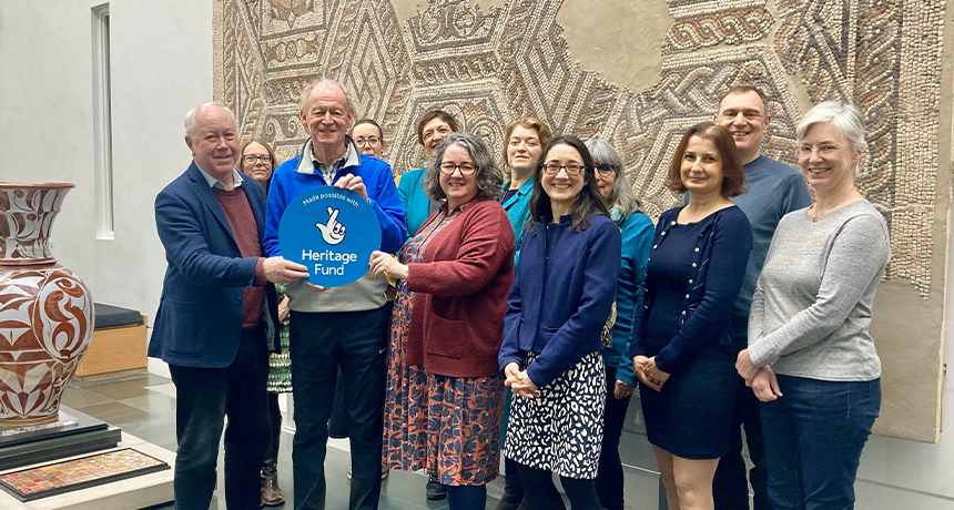 Photo of the team in the museum, holding a Heritage fund plaque.