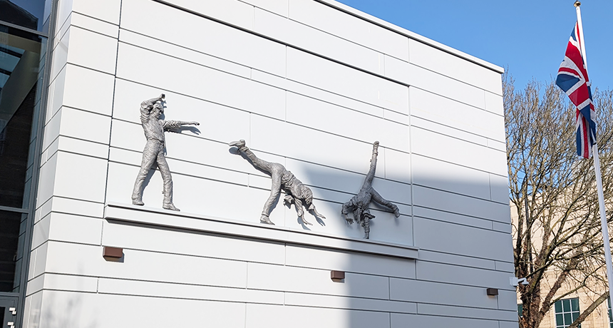 photo of the catwheeling boys sculpture installed on the side of the new council offices
