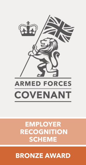 The Armed Forces Covenant Employer Recognition Scheme Bronze Award logo, featuring a lion holding a Union Jack flag beneath a crown, with the text "Armed Forces Covenant" and "Employer Recognition Scheme — Bronze Award."