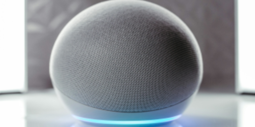 A white smart speaker with a glowing blue light ring at its base, on a reflective surface.